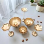 Bohemian living room Diwali decor with hammered metal urli set holding fresh flowers