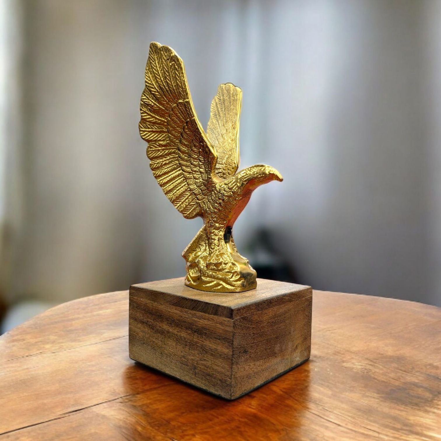 Eagle Sculpture Gift Close-up of detailed brass eagle sculpture showing textured feathers and sharp talons.