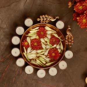 Traditional Indian urli bowls with peacock design & diya holders