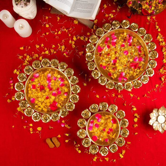 Urli bowls with floating diya and flowers