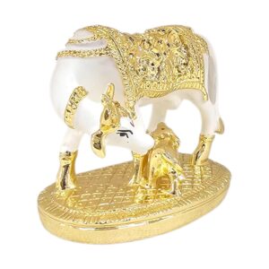 Side profile view of gold plated Kamdhenu cow