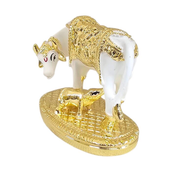 Side profile view of gold plated Kamdhenu cow