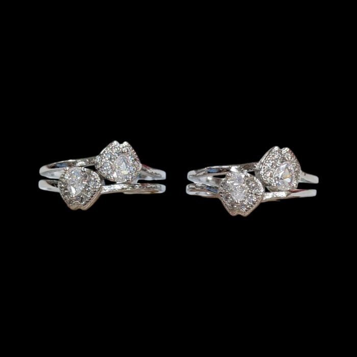 Close up of silver toe rings with zirconia stones