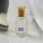 Close up of Large Sandal gold attar perfume oil bottle