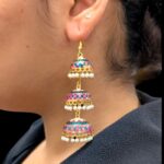 Model wearing 3 Tier Meena Jhumki earrings