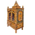 Side profile view of wooden home mandir with door