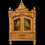 Close up of wooden mandir with door and glass panes