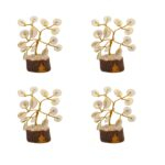 Four Gomti Chakra Tree of Life pieces arranged for creating balanced energy in the four directions.