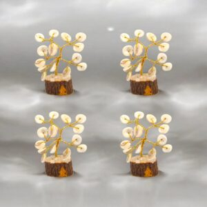 Set of four small Tree of Life decorations with natural spiral Gomti Chakra stones on brass stems and wooden bases.