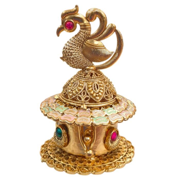 Close-up view of the intricate peacock designed on the sindoor box lid.