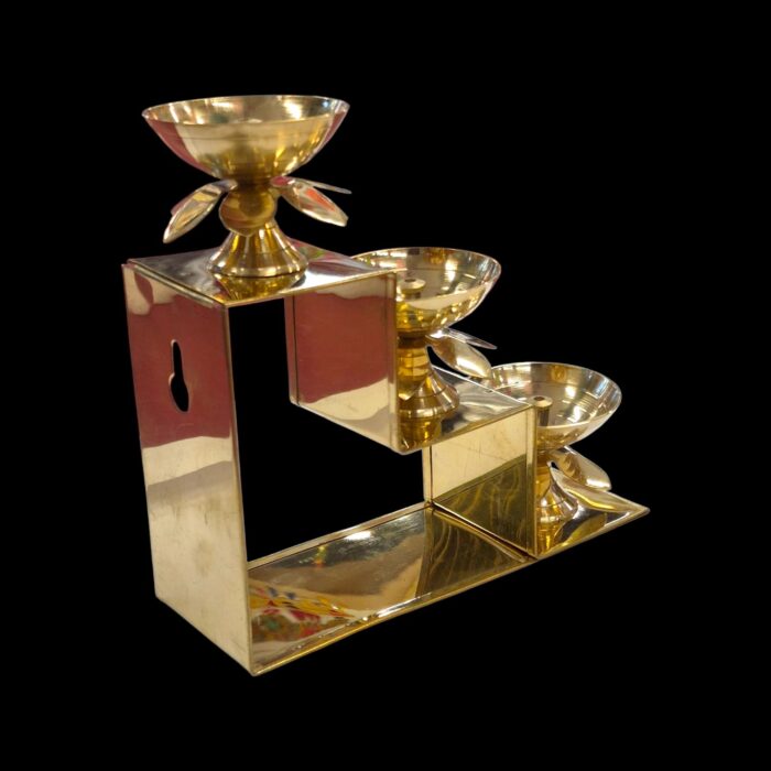 Side profile view of 3 step brass diya
