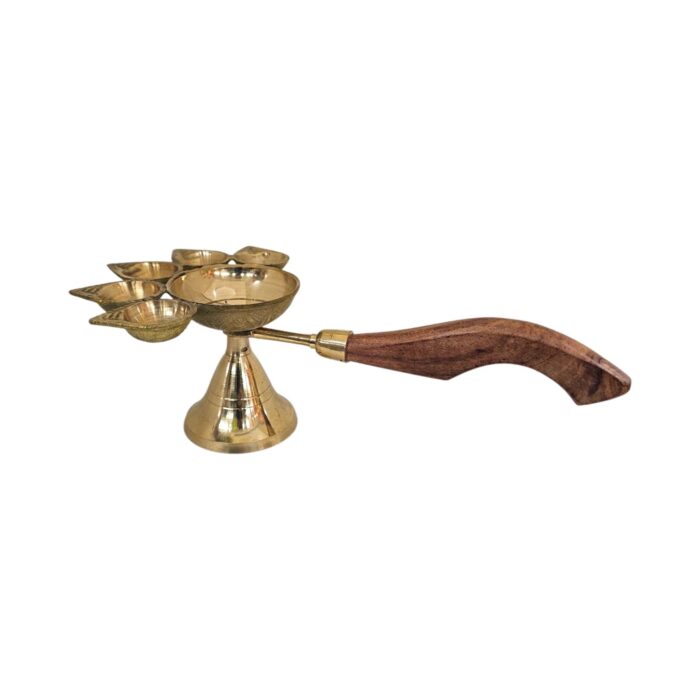 Close up of wooden handle connected to Brass panch deepam