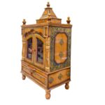 Side profile view of wooden home mandir with door