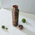 Handcrafted pure copper water bottle, 1000ml, with a unique printed finish.