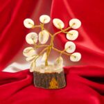 Detailed view of the authentic, natural spiral pattern of a Gomti Chakra stone in a Tree of Life setting.