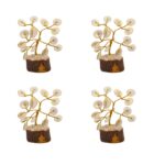 Four Gomti Chakra Tree of Life pieces arranged for creating balanced energy in the four directions.