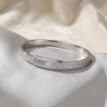 Unisex sterling silver bracelet with cubic zirconia detailing