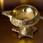 Top view of the brass kuber diya with a tortoise base