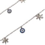 Close up of the pair of silver anklets with small charms with cz stone