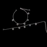 Pair of 925 sterling silver with charms and rhodium finish placed on black velvet screen