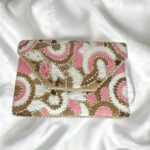 Pink floral embroidered clutch bag front view