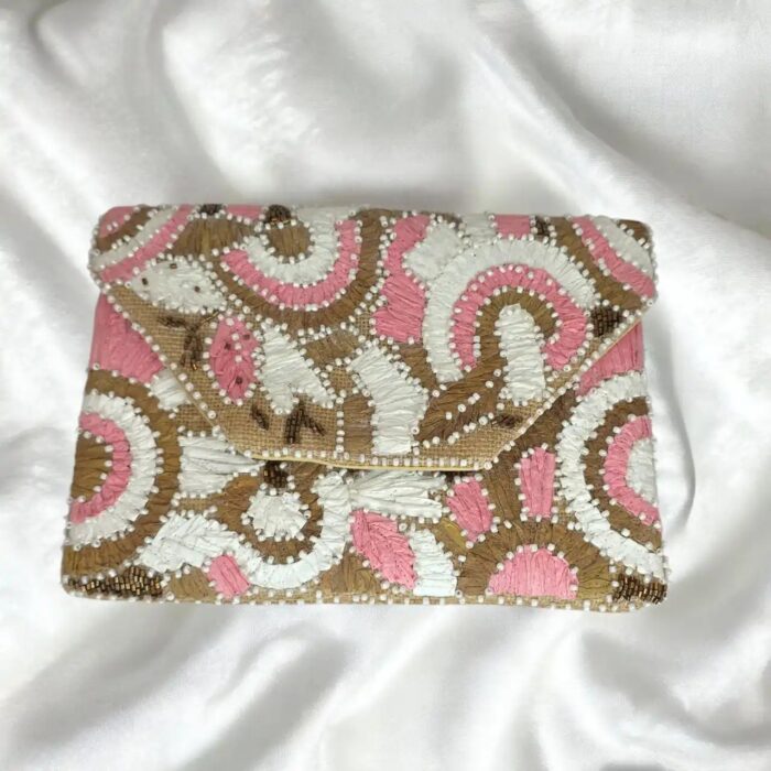 Pink floral embroidered clutch bag front view