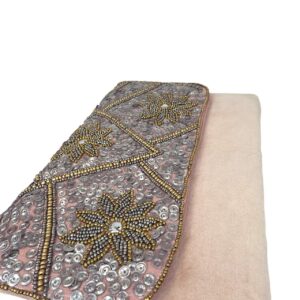 Close up of Elegant handmade beaded suede clutch bag for parties