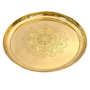 Close up of large brass plate for pooja and home decor